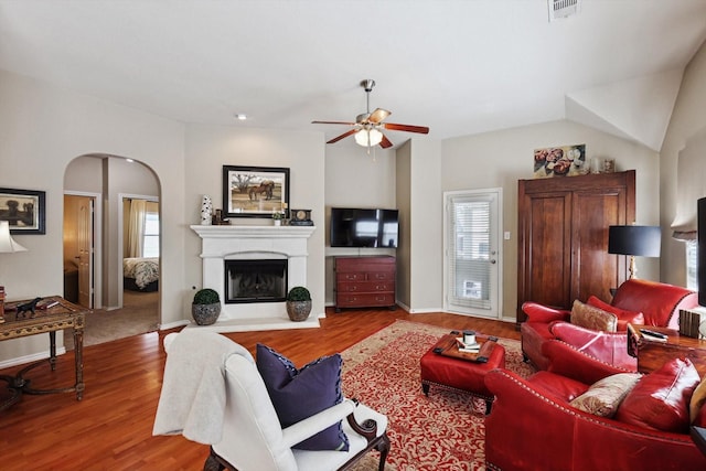 living room featuring hardwood / wood-style flooring and ceiling fan