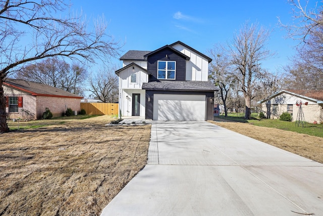 view of front of home with an attached garage, a shingled roof, fence, concrete driveway, and a front yard