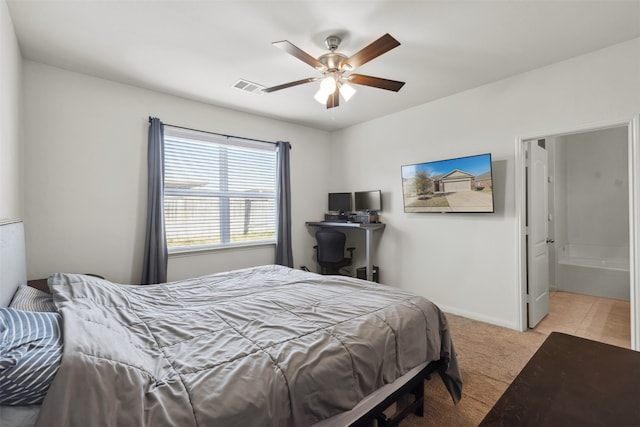 carpeted bedroom featuring connected bathroom and ceiling fan