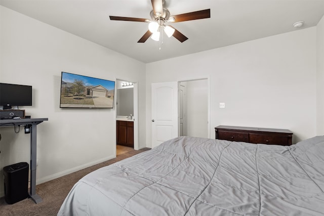carpeted bedroom featuring connected bathroom and ceiling fan