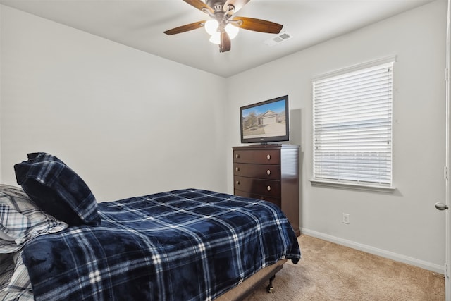 carpeted bedroom featuring ceiling fan