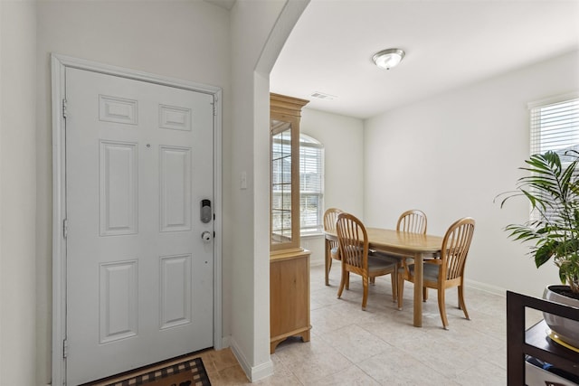 foyer entrance featuring light tile patterned floors