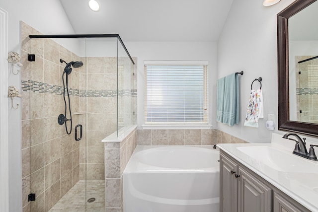 bathroom featuring separate shower and tub and vanity