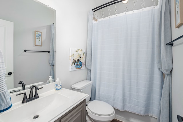 full bathroom featuring toilet, vanity, and shower / bath combination with curtain