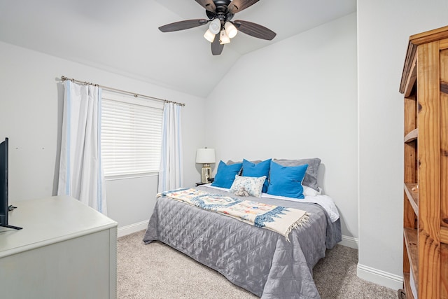 carpeted bedroom featuring vaulted ceiling and ceiling fan