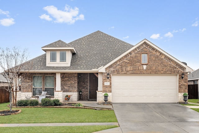 view of front facade featuring a garage and a front yard