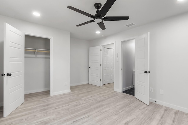 unfurnished bedroom with ceiling fan and light hardwood / wood-style floors