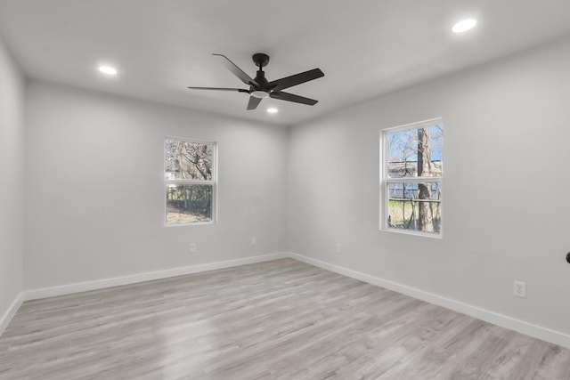 unfurnished room featuring ceiling fan and light hardwood / wood-style flooring