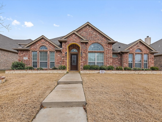 view of front of home with a front yard