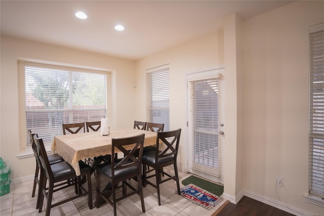 dining area featuring recessed lighting and baseboards