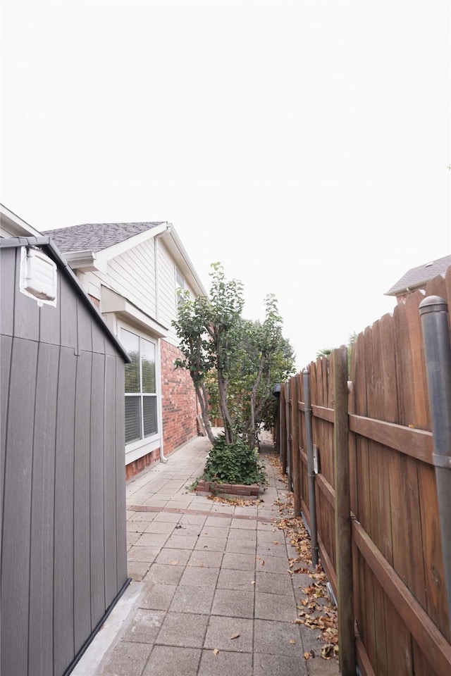 view of patio featuring fence