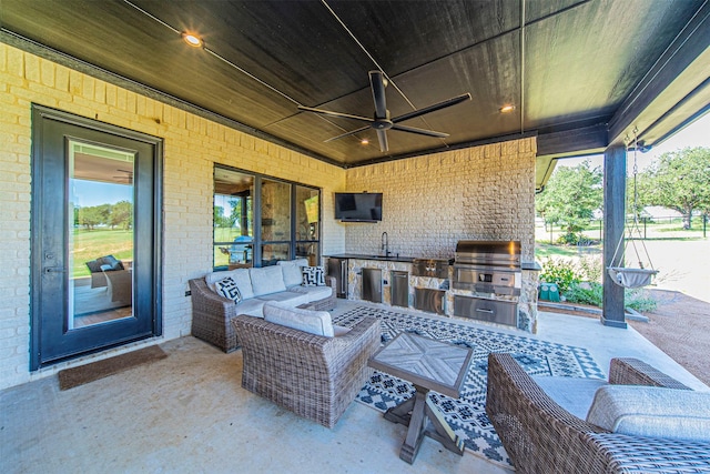 view of patio with grilling area, ceiling fan, an outdoor hangout area, area for grilling, and sink