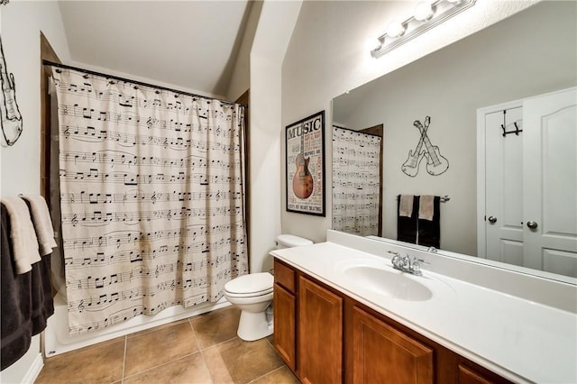 full bathroom with toilet, tile patterned floors, shower / tub combo with curtain, and vanity