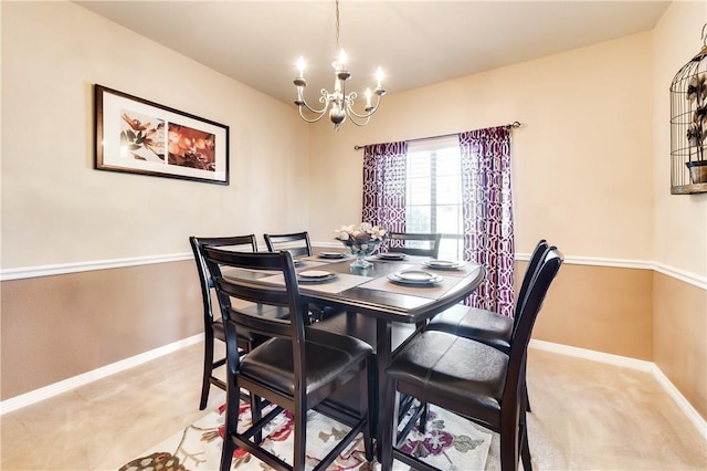 carpeted dining room with an inviting chandelier