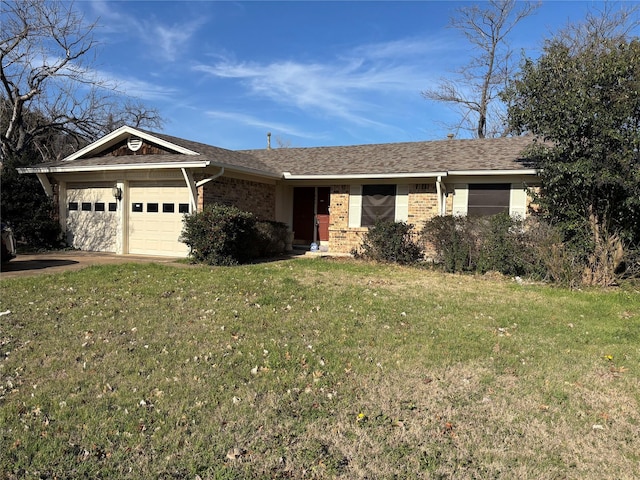 ranch-style house featuring a front lawn and a garage