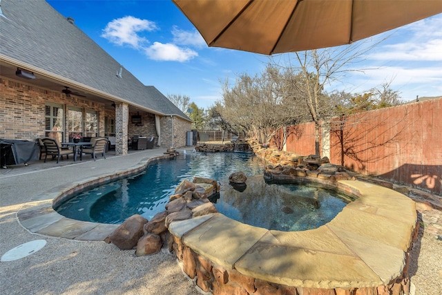 view of swimming pool featuring grilling area and a patio area