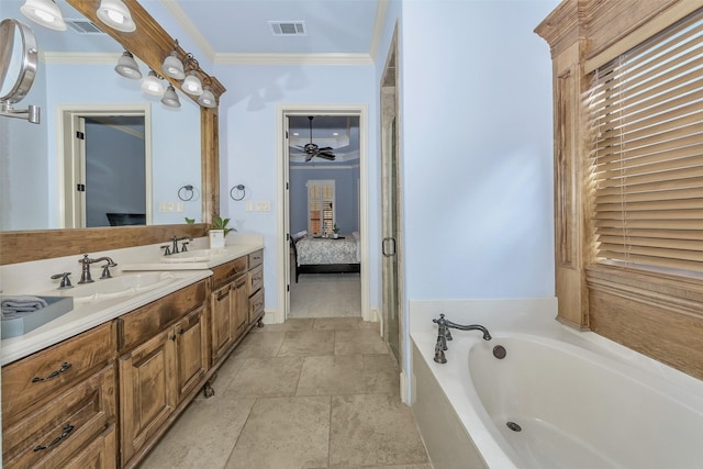 bathroom with vanity, tiled tub, and crown molding