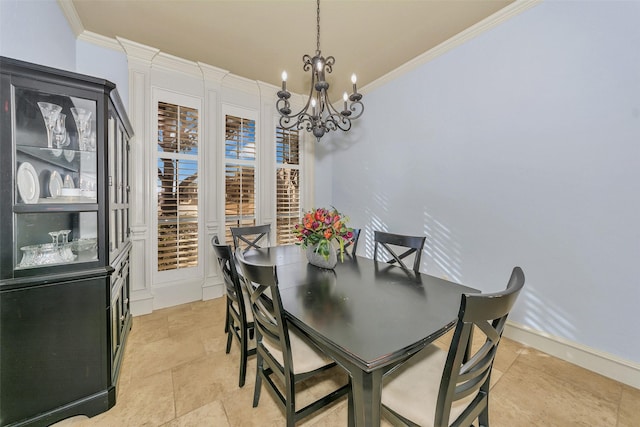 dining area with crown molding and an inviting chandelier