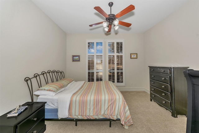 bedroom with light carpet and ceiling fan