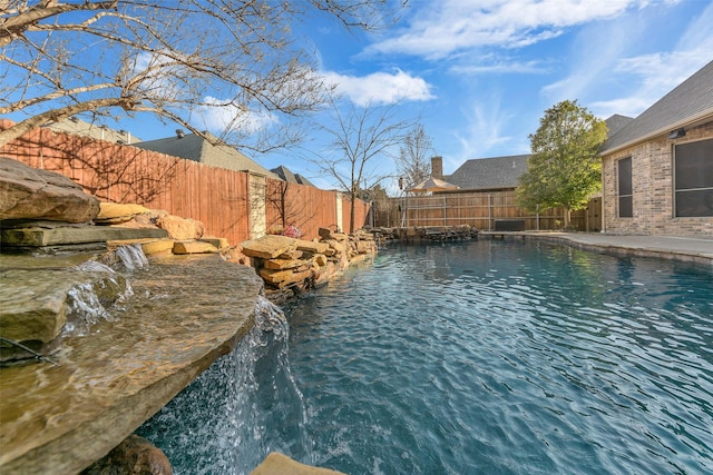 view of pool with pool water feature