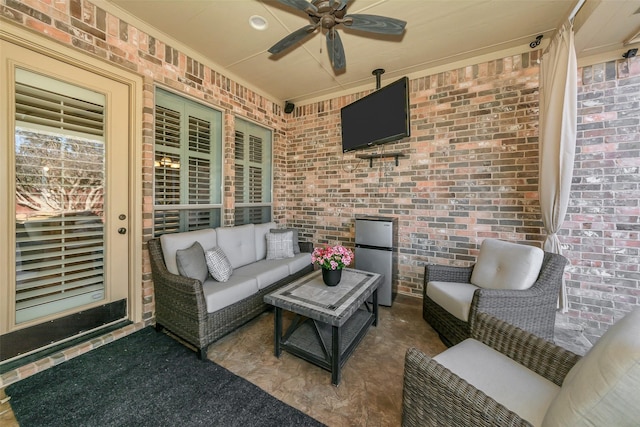 view of patio with an outdoor living space and ceiling fan