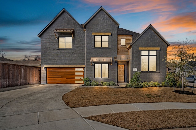 view of front of property with a garage