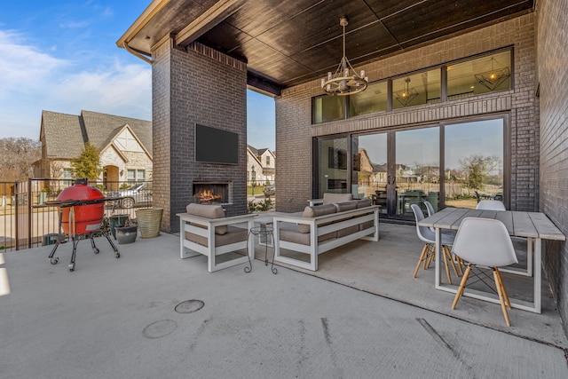 view of patio / terrace featuring an outdoor living space with a fireplace