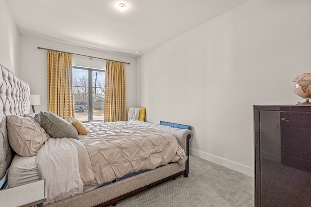 bedroom featuring light carpet