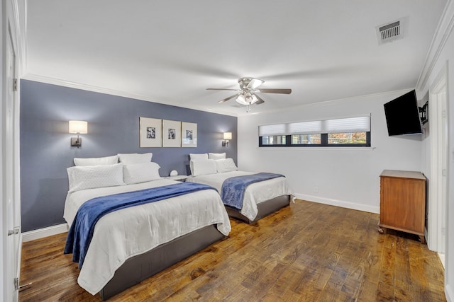 bedroom featuring ceiling fan, dark wood-type flooring, and crown molding