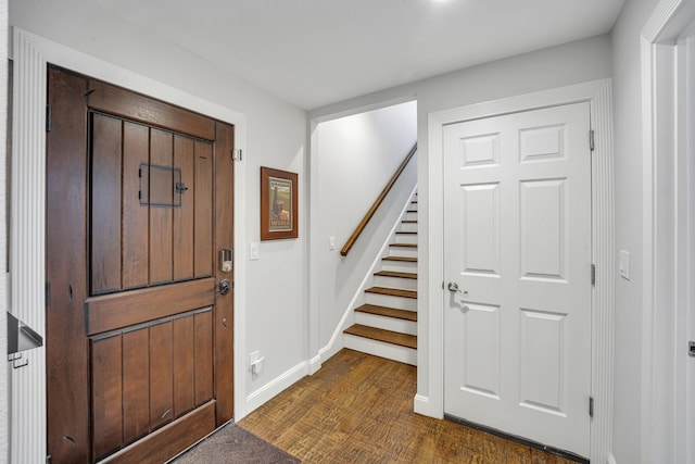 foyer with dark hardwood / wood-style flooring