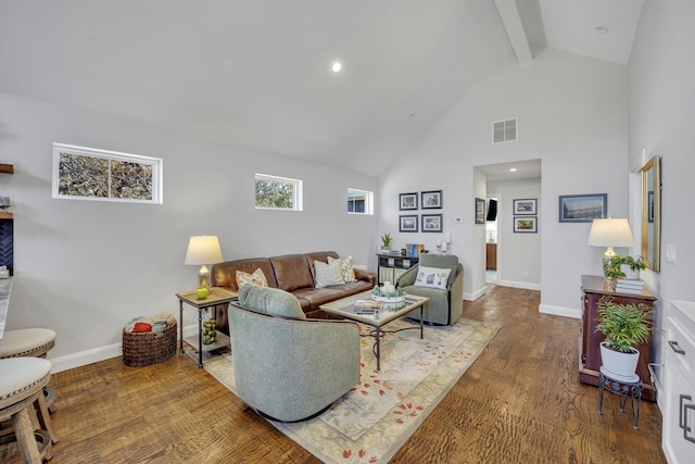 living room featuring hardwood / wood-style flooring, beamed ceiling, and high vaulted ceiling