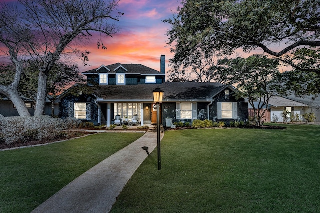 view of front of home featuring a lawn