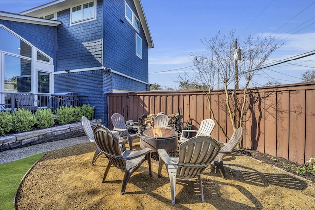 view of patio / terrace featuring an outdoor fire pit