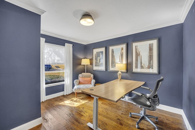 office area featuring hardwood / wood-style flooring and crown molding