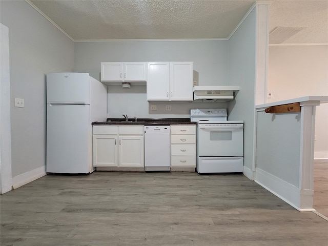 kitchen featuring ornamental molding, white appliances, white cabinets, and light hardwood / wood-style flooring