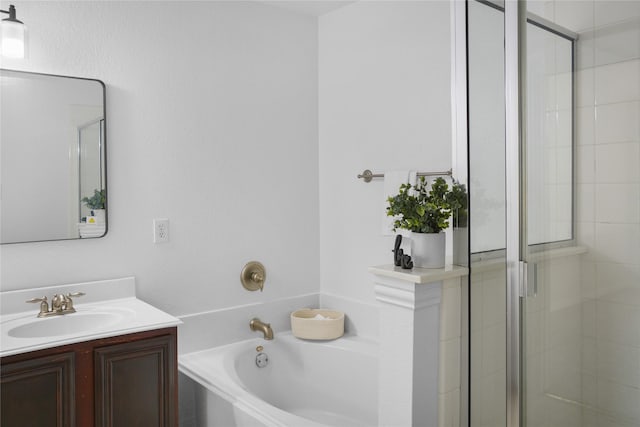 bathroom featuring vanity and shower with separate bathtub