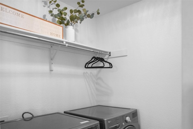 spacious closet featuring washer and clothes dryer