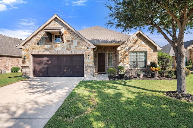 view of front of house with a garage and a front yard