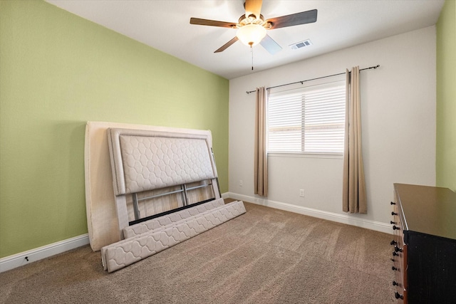 unfurnished bedroom featuring ceiling fan and carpet floors