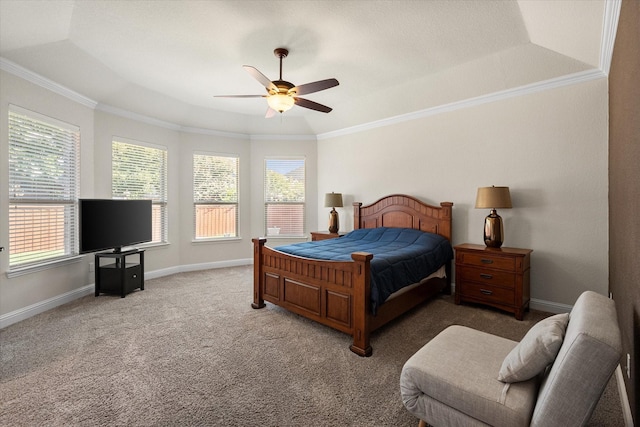 carpeted bedroom featuring a raised ceiling, ceiling fan, and ornamental molding