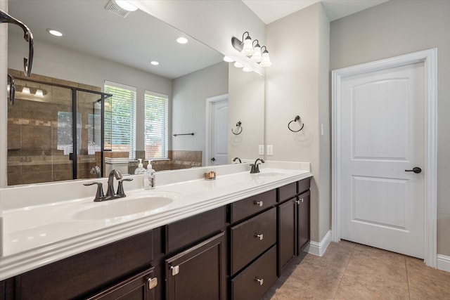 bathroom with vanity, tile patterned flooring, and an enclosed shower