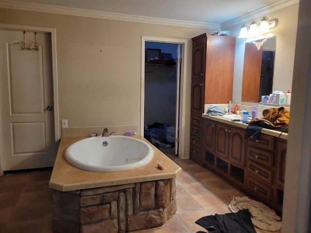 bathroom featuring ornamental molding, vanity, and a bathing tub