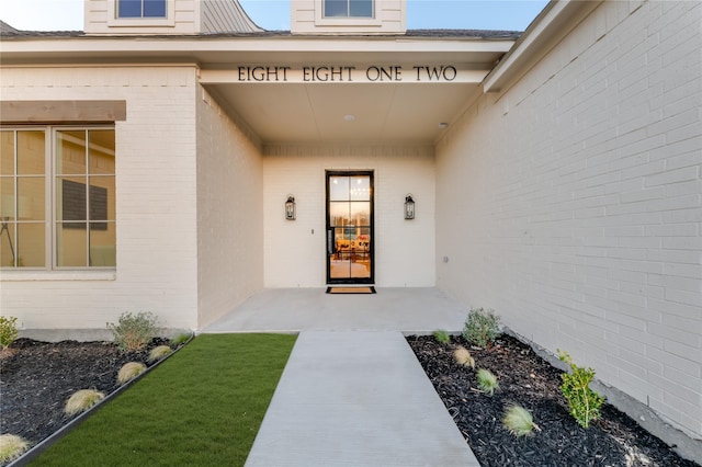 entrance to property with brick siding