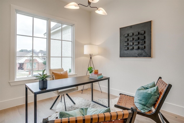 office featuring baseboards and wood finished floors