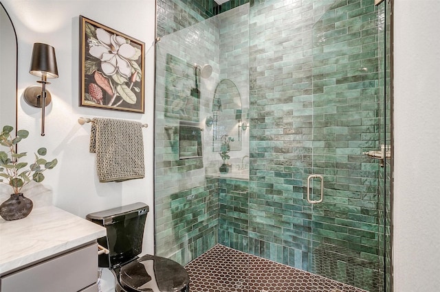 full bathroom with a shower stall and vanity