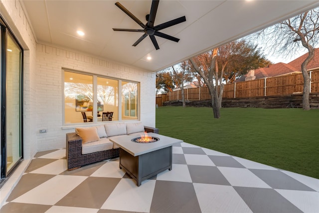 view of patio with an outdoor fire pit, a ceiling fan, and a fenced backyard