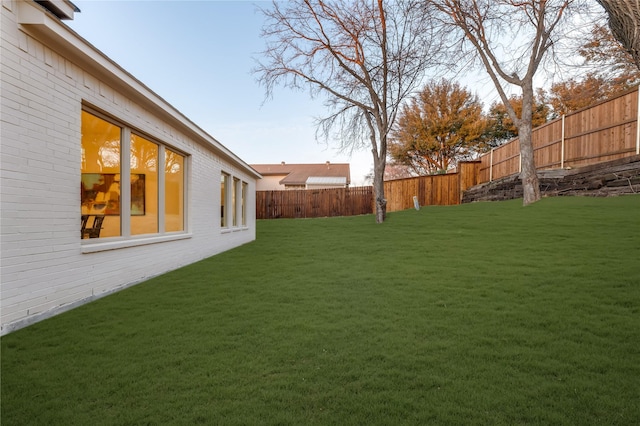 view of yard featuring a fenced backyard