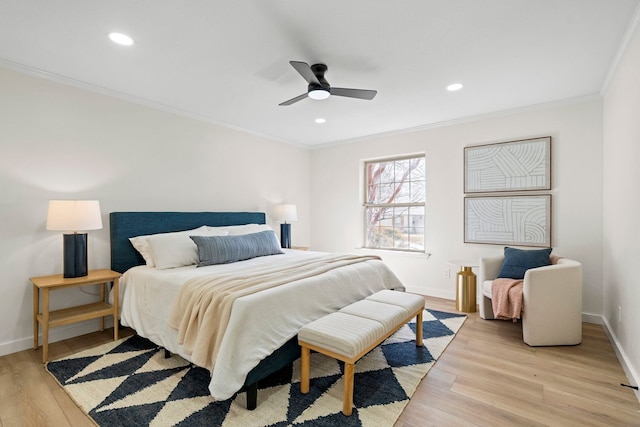 bedroom with recessed lighting, baseboards, crown molding, and light wood finished floors