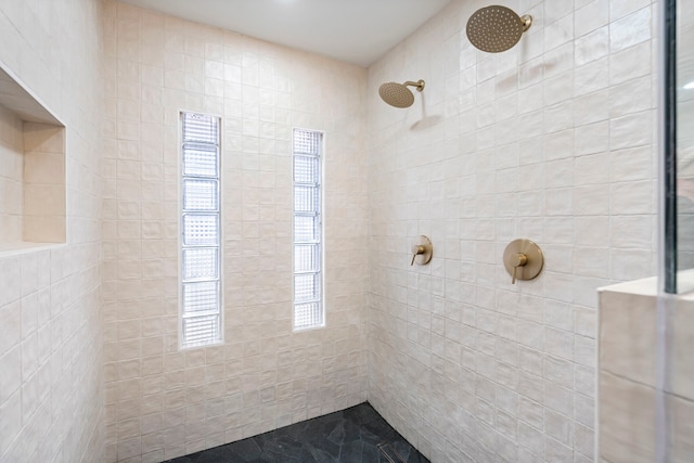 bathroom with tiled shower