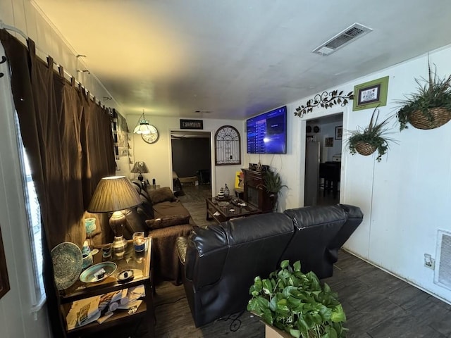 living room with dark hardwood / wood-style floors